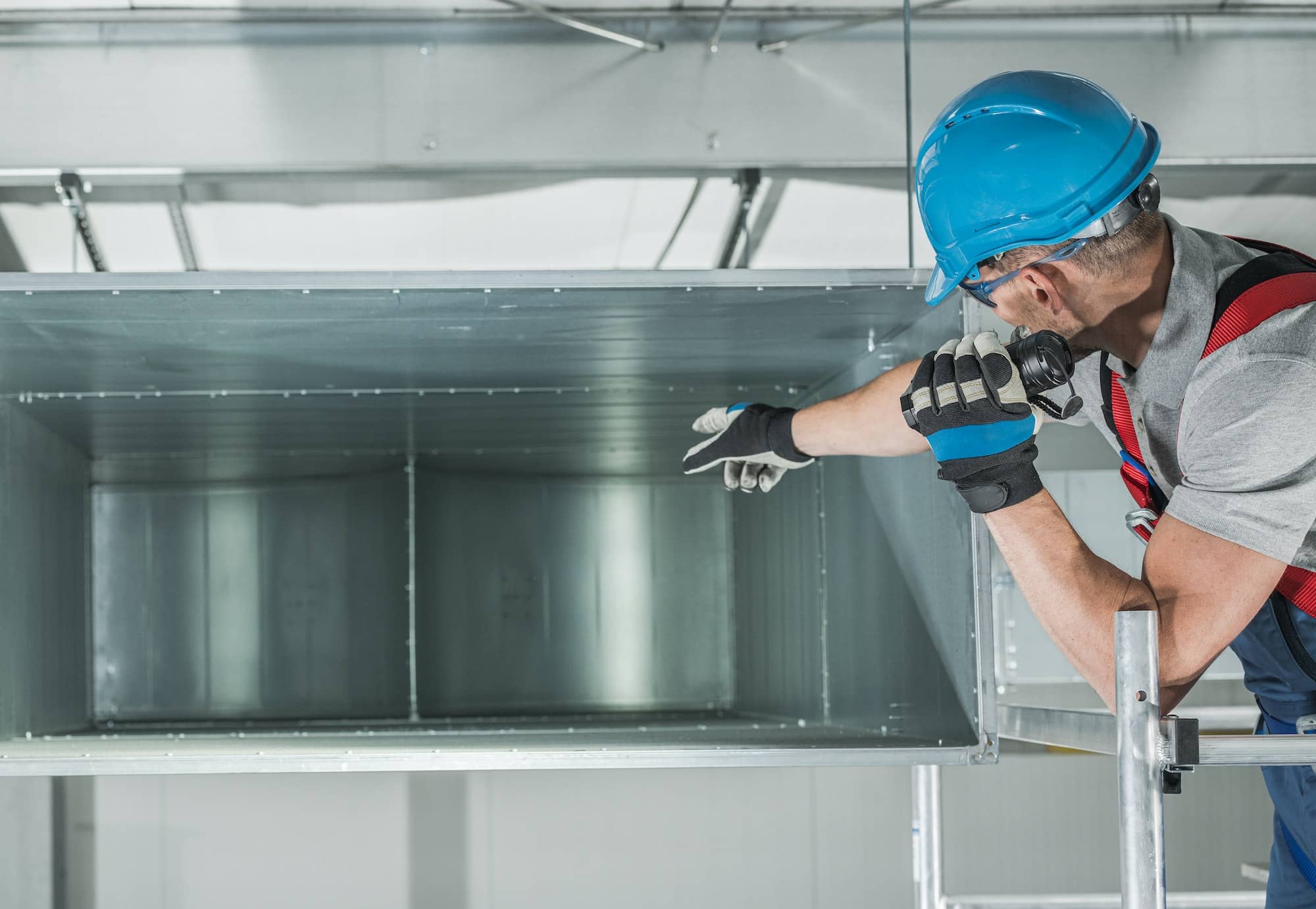 HVAC Technician Performing Scheduled Air Heating and Cooling System Checkup.